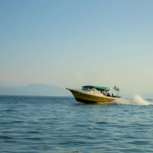 Crew and guests aboard a boat on the water