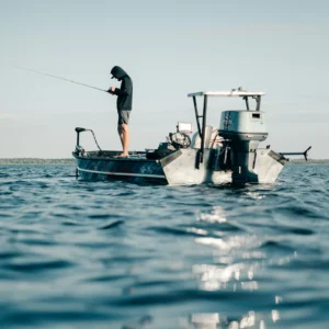 Angler fishing from a small boat on the open ocean