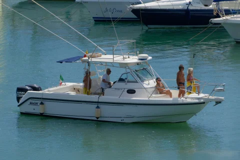 Sport fishing boat with anglers docked at a Hawaii marina