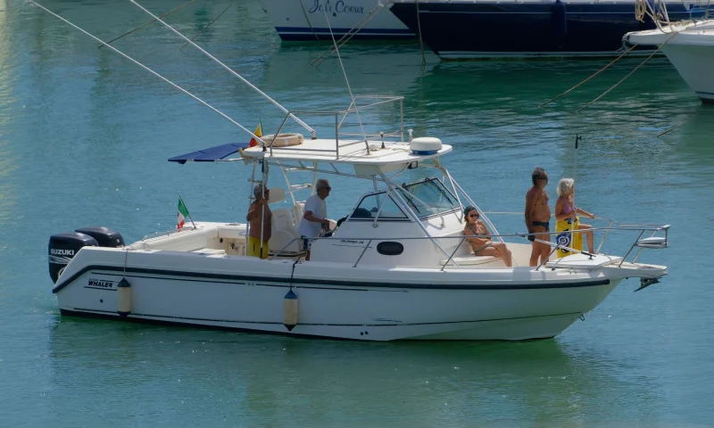 Sport fishing boat with anglers docked at a Hawaii marina
